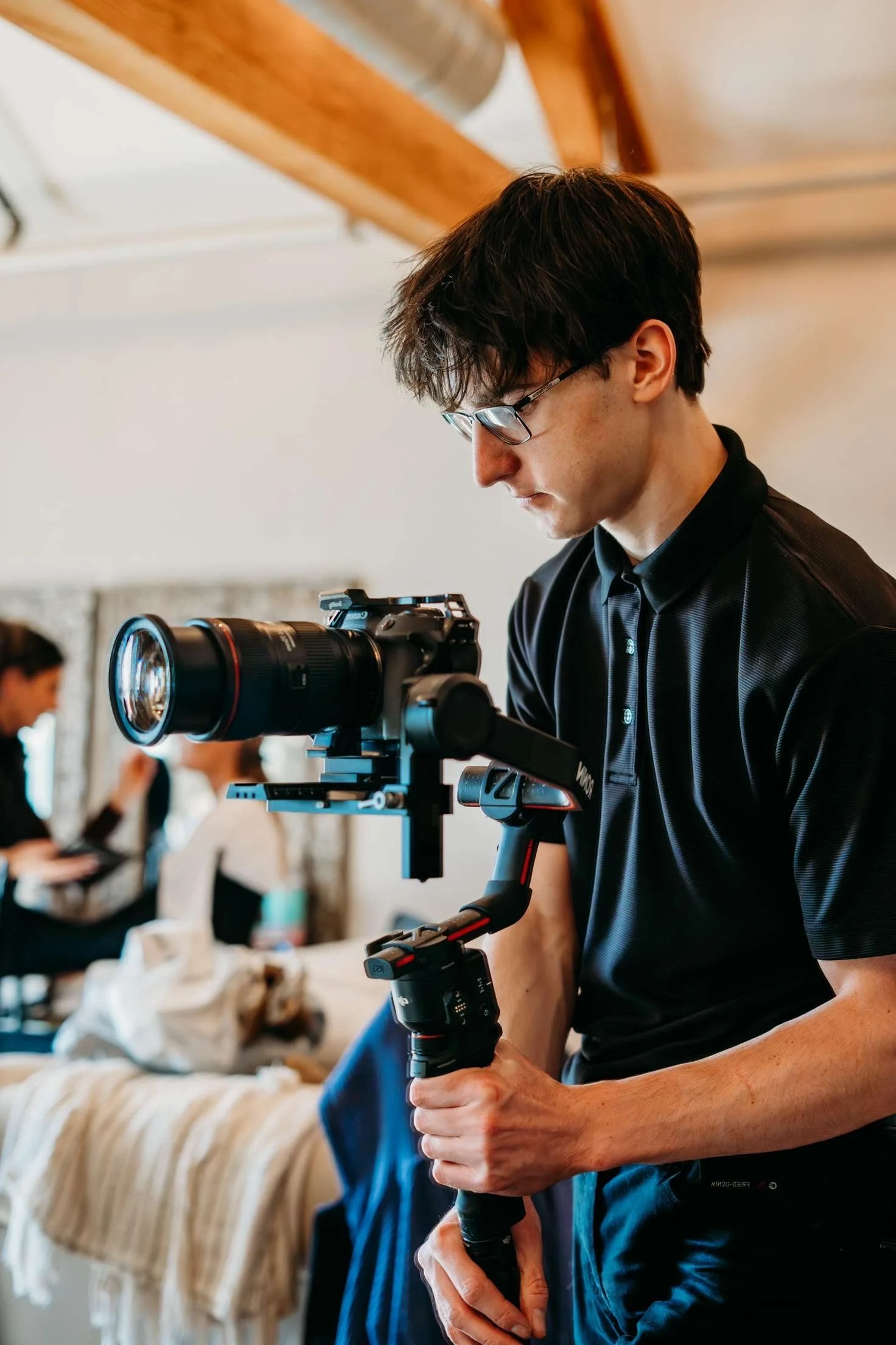 Kobe operating a camera on a gimbal
